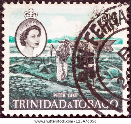 TRINIDAD AND TOBAGO - CIRCA 1960: A stamp printed in Trinidad and Tobago shows Pitch Lake and Queen Elizabeth II, circa 1960.