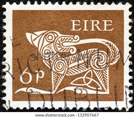IRELAND - CIRCA 1968: A stamp printed in Ireland shows a dog from an ancient artwork, circa 1968.