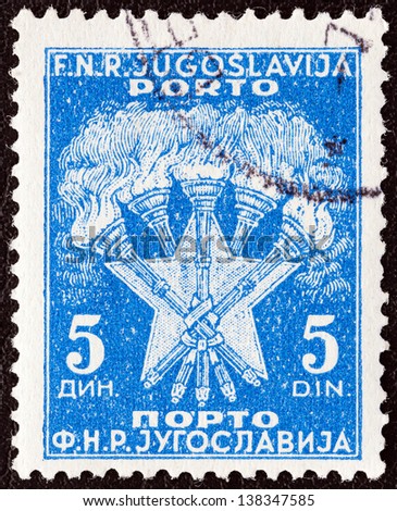 YUGOSLAVIA - CIRCA 1952: A stamp printed in Yugoslavia shows 5 Torches and Star, the Coat of Arms of Yugoslavia, circa 1952.