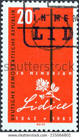 GERMAN DEMOCRATIC REPUBLIC - CIRCA 1962: A stamp printed in Germany issued for the 20th anniversary of Destruction of Lidice shows Cross of Lidice, circa 1962.