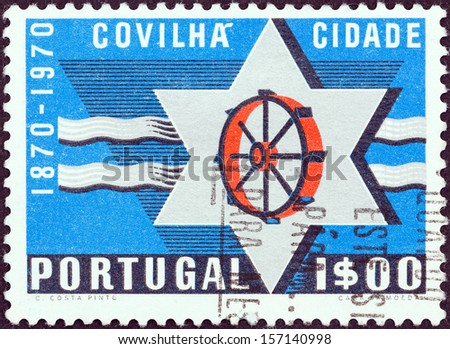 PORTUGAL - CIRCA 1970: A stamp printed in Portugal issued for the Centenary of City of Covilha shows Star and wheel from Covilha coat of arms, circa 1970.