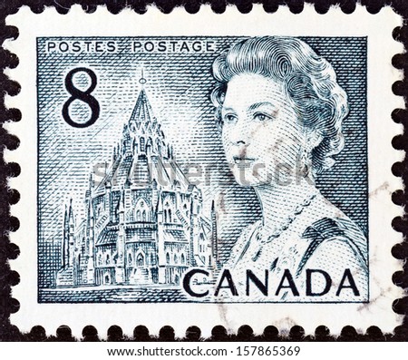 CANADA - CIRCA 1967: A stamp printed in Canada shows Queen Elizabeth II and Library of Parliament, circa 1967.