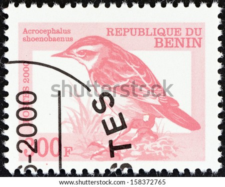 BENIN - CIRCA 2000: A stamp printed in Benin shows a Sedge Warbler (Acrocephalus shoenobeanus) bird, circa 2000.