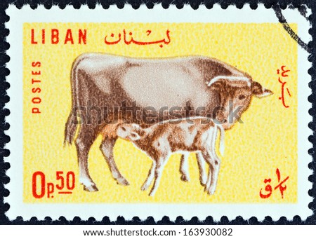 LEBANON - CIRCA 1965: A stamp printed in Lebanon shows Cow and calf, circa 1965.