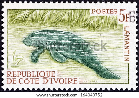 IVORY COAST - CIRCA 1963: A stamp printed in Ivory Coast shows an African manatee (Trichechus senegalensis), circa 1963.