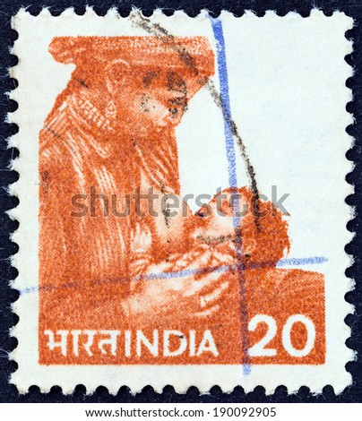 INDIA - CIRCA 1981: A stamp printed in India shows Mother feeding child, circa 1981.