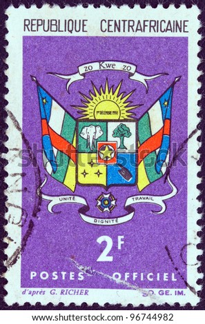 CENTRAL AFRICAN REPUBLIC - CIRCA 1965: A stamp printed in Central African Republic shows Coat Of Arms, circa 1965.