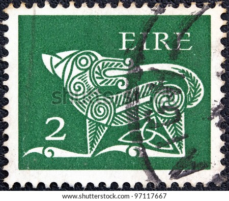 IRELAND - CIRCA 1971: A stamp printed in Ireland shows a dog from an ancient artwork, circa 1971.