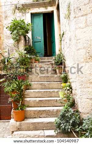 Open green wooden door in Trogir, Croatia.