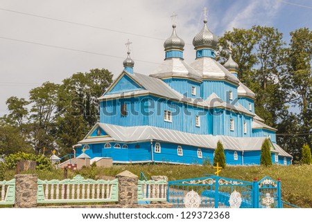 Blue old wooden Orthodox church near Ostroh town - Ukraine.
