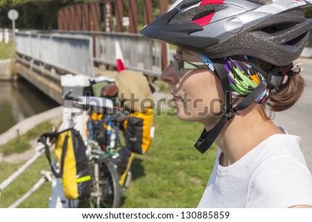 Travel by bicycles - women face with  Sports helmet on the head. Ukraine , Europe.