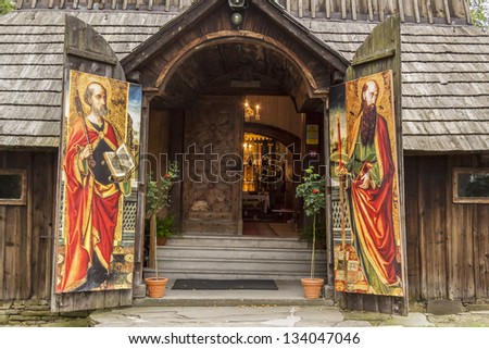 LACHOWICE, POLAND - AUGUST 26: Front  of church holy Apostles Peters and Pawel and pattern wooden door on august 26, 2012 in Lachowice.