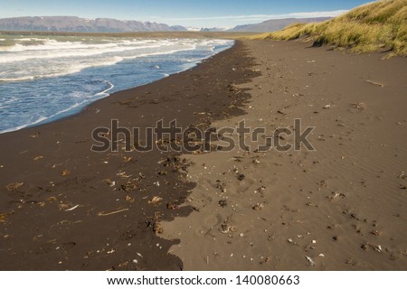 Sandy brown beach in Saudarkrokur town - Iceland.