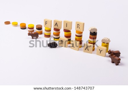Fair play game - wooden column on white background.