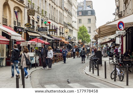 Paris, France - April 26: Tourists Walk Past A Cafeteria And Souvenir Store On April 26, 2013 In Paris. Paris Is The Most Visited City In The World.