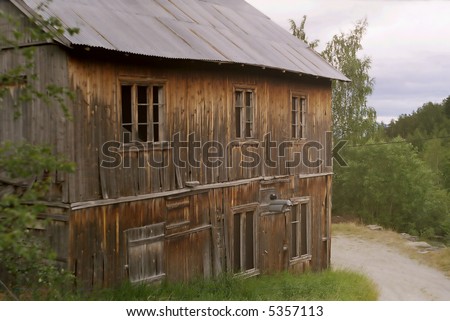 A house in a Norwegian village. Apparently abandoned and left to ruin.