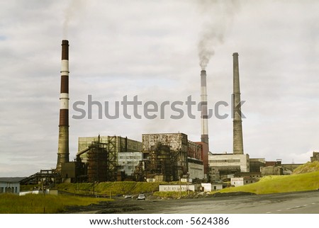 Old factory in russia. harmful pollution obsolete technology.