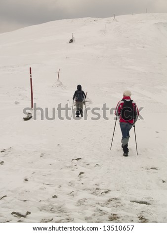 Two person on the snow. Winter trekking