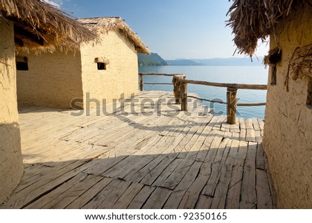 stock-photo-old-cottage-on-the-water-museum-near-ohrid-macedonia-92350165.jpg