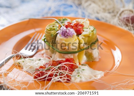 Presentation of a plate of rolls with crab meat