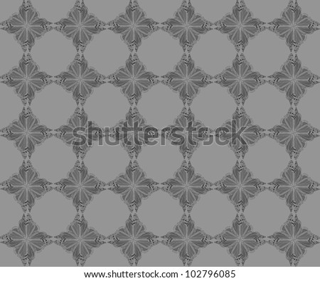 Butterfly pattern of four butterflies pasted at 45 degree angles, in a diamond shape. Inverted dark gray butterflies, light gray background. / Diamond Butterfly Pattern #72 / Great retro styling.