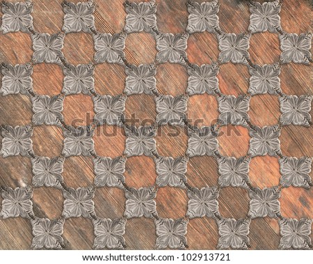 Vintage and well worn wood background with steel butterfly checkerboard pattern. / Steel Butterfly Interlock on Wood / Parquet floor tile, computer background or texture, use your imagination!