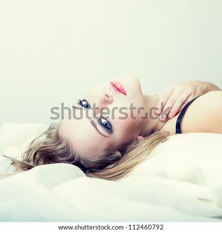 portrait of a sensual girl in bed - stock photo