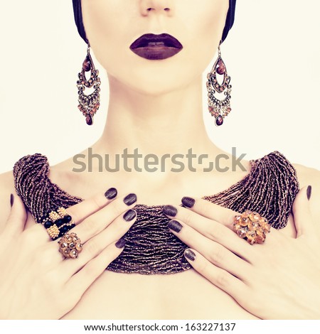 Portrait of a beautiful girl in stylish jewelry