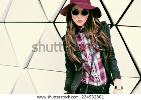 Girl in vintage Hat and Sunglasses on street. Fashion style