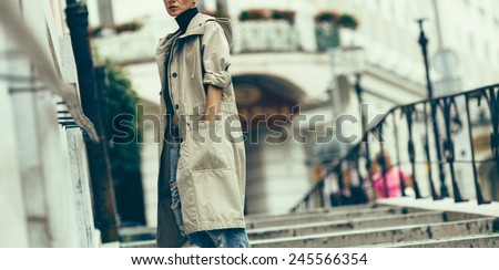 Girl standing on city street. Active urban style.