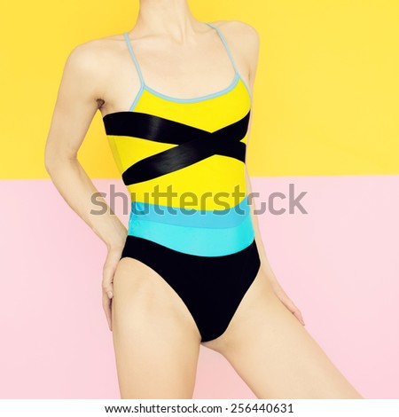 Model in fashionable bright swimsuit. Trend of the summer season.