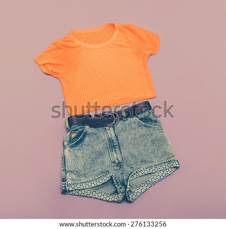 Vintage Ladies Denim shorts and bright Shirt. Glamorous style