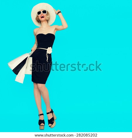 Happy Shopping Woman with shopping bags on blue background
