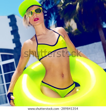 Bright Fashion Girl DJ in pool Hot Summer party style