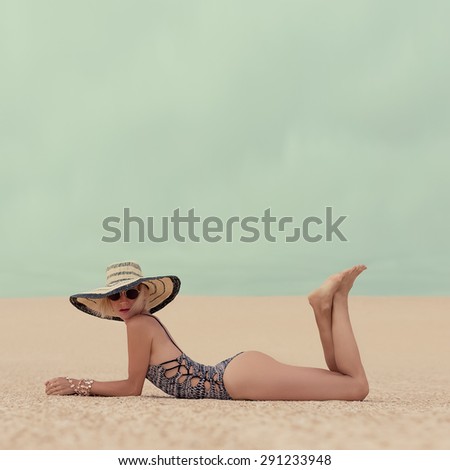Fashion Glamorous Lady on Vacation at the Beach