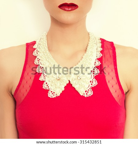 Glamorous Lady with decoration on neck. Lace collar