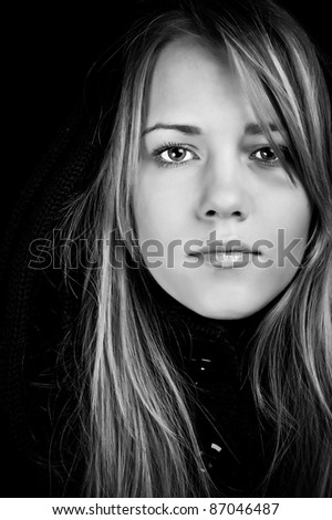 Portrait of a beautiful woman on a black background