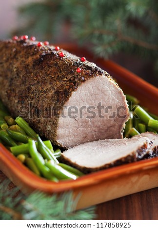 Roast beef with spices and green beans. Selective focus