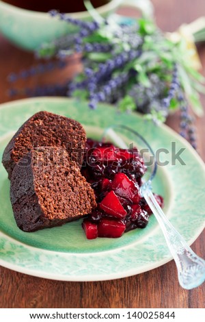 Chocolate cake with oat bran and pear-currant compote with lavender, selective focus