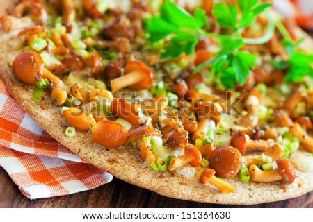 Oat bran flat bread with cheese and honey mushrooms, selective focus