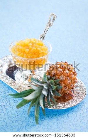 Homemade pineapple jam and fresh pineapple, selective focus