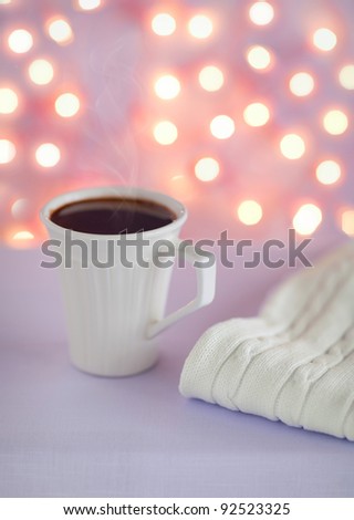 Cup of hot lavender chocolate on the table, selective focus