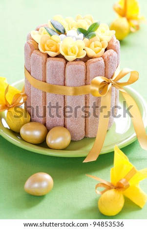 Easter chocolate cake decorated with flowers and quail eggs, selective focus