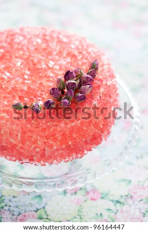 Rose gelatin cake on cake stand, selective focus