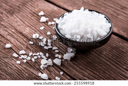 sea salt in bowl on wooden background