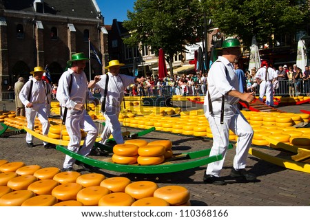 ALKMAAR, NETHERLANDS - AUGUST 10: Cheese carriers at the traditional cheese market on August 10, 2012 in Alkmaar, Netherlands. Every friday morning there is a typical cheese market at Alkmaar.