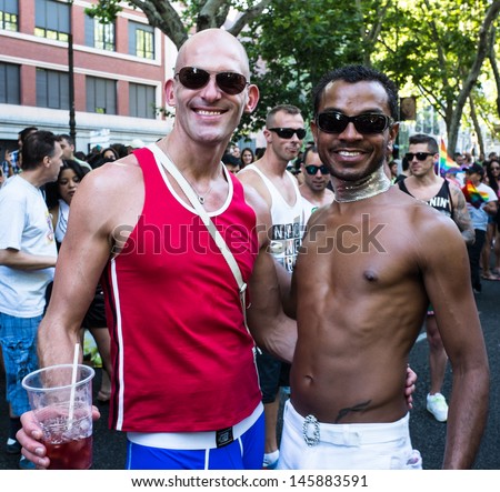 MADRID, SPAIN - JULY, 6: People participating at the Gay Pride parade on July 6, 2013 in Madrid (Spain). Near 1,200,000 people from all over the world participated at the Gay Pride Parade in Madrid.