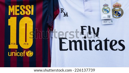 MADRID, SPAIN - OCTOBER 25, 2014: A couple of T-shirts for supporters of Real Madrid and Barcelona watching at Santiago Bernabeu Stadium while the Real Madrid-Barcelona match.