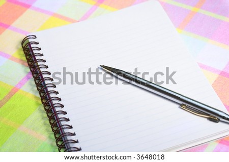 Note book paper and pen