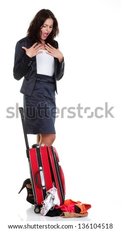 Full length of young business woman to late mishap misadventure pulling red travel bag clock isolated on white background